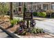 Emory Parc Manor community sign surrounded by colorful flowers and manicured landscaping at 1967 Mason Mill Rd, Decatur, GA 30033