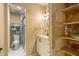 Small bathroom featuring a glass door shower, vanity, and open shelves with zebra-themed wallpaper at 4 Quail Run, Decatur, GA 30035
