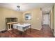 Dining room with white table, laminate floors, and modern lighting at 4 Quail Run, Decatur, GA 30035