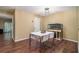 Bright dining room with modern table, laminate floors, and natural light at 4 Quail Run, Decatur, GA 30035