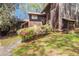 Unique townhome with weathered wood siding and mature landscaping at 4 Quail Run, Decatur, GA 30035