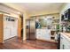 Updated kitchen featuring stainless appliances, white cabinets, and a convenient laundry area at 4 Quail Run, Decatur, GA 30035