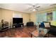 Comfortable living room with hardwood floors, a large TV, and inviting furniture at 4 Quail Run, Decatur, GA 30035