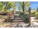 Stone steps with landscaped gardens lead up to the home, creating a welcoming entrance at 4 Quail Run, Decatur, GA 30035