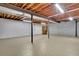 Unfinished basement has exposed beams, concrete walls, and a poured concrete floor at 567 Shiloh Nw Rd, Kennesaw, GA 30144