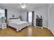 Bright bedroom featuring hardwood floors, and a modern dresser at 567 Shiloh Nw Rd, Kennesaw, GA 30144
