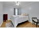Cozy bedroom with hardwood floors, ceiling fan, and plenty of light at 567 Shiloh Nw Rd, Kennesaw, GA 30144