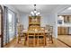 Charming dining room with a wooden table set and chandelier lighting at 567 Shiloh Nw Rd, Kennesaw, GA 30144