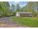 Beautiful single-story home with a long drive, attached garage, and well-maintained lawn and landscaping at 567 Shiloh Nw Rd, Kennesaw, GA 30144