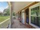 Inviting front porch with brick accents, decorative pillars, and a charming welcome mat at 567 Shiloh Nw Rd, Kennesaw, GA 30144