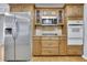 Updated kitchen featuring wooden cabinets, granite countertops, and stainless steel appliances at 567 Shiloh Nw Rd, Kennesaw, GA 30144