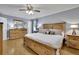 Main bedroom featuring a king bed, hardwood floors, and a large dresser at 567 Shiloh Nw Rd, Kennesaw, GA 30144