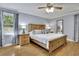 Spacious main bedroom featuring hardwood floors and a king bed at 567 Shiloh Nw Rd, Kennesaw, GA 30144