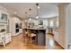 Spacious kitchen with an island, double oven, white cabinets, and stainless steel appliances at 973 Meadow Club Ct, Suwanee, GA 30024