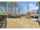 Large backyard with a deck, stairs, and privacy fence at 1599 Benham Dr, Snellville, GA 30078