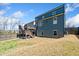 Backyard view showcasing the home's exterior, deck, and fenced-in yard at 1599 Benham Dr, Snellville, GA 30078