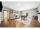 Finished basement featuring a custom bar area with a drink fridge and open shelves at 1599 Benham Dr, Snellville, GA 30078