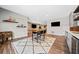Finished basement area with a bar, hardwood floors, and comfortable seating for entertaining at 1599 Benham Dr, Snellville, GA 30078