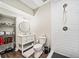 Bright bathroom with a stand up shower, vanity, and open shelving at 1599 Benham Dr, Snellville, GA 30078