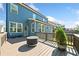 View of the expansive wooden deck, perfect for outdoor entertaining with a fire pit and views at 1599 Benham Dr, Snellville, GA 30078