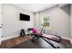 Home gym area with treadmill and free weights at 1599 Benham Dr, Snellville, GA 30078