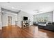 Spacious living room featuring hardwood floors, a ceiling fan, and plenty of natural light at 1599 Benham Dr, Snellville, GA 30078