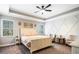 Serene main bedroom featuring tray ceilings, neutral colors, and ample natural light at 1599 Benham Dr, Snellville, GA 30078