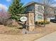 Charming neighborhood entrance sign with stone accents and lush landscaping at 1599 Benham Dr, Snellville, GA 30078