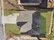 Aerial view of the home showcasing the roof, landscaping, and fenced backyard at 7686 Brazos Trl, Fairburn, GA 30213