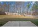 Fenced backyard with lawn and patio at 7686 Brazos Trl, Fairburn, GA 30213