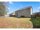 A view of the backyard showing the lawn and fence at 7686 Brazos Trl, Fairburn, GA 30213