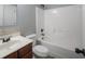 Bathroom with single sink vanity and a shower-tub combo at 7686 Brazos Trl, Fairburn, GA 30213