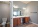 Spacious bathroom with double sink vanity and hardwood floors at 7686 Brazos Trl, Fairburn, GA 30213