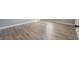 Bedroom with wood-look flooring and neutral walls at 7686 Brazos Trl, Fairburn, GA 30213