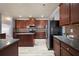 Bright and modern kitchen with stainless steel appliances, granite counters, and plenty of storage at 7686 Brazos Trl, Fairburn, GA 30213
