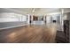Expansive open-concept living area featuring hardwood floors and a fireplace at 7686 Brazos Trl, Fairburn, GA 30213
