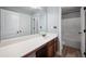 Bright main bathroom features wood floors, double sinks, granite counters, and walk-in shower at 7686 Brazos Trl, Fairburn, GA 30213