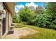 View of the backyard showing the greenery, trees, and patio at 905 Magnolia Gardens Walk, Mcdonough, GA 30253