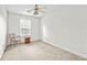 Cozy bedroom with neutral carpet, ceiling fan, and a window to create a comfortable retreat at 905 Magnolia Gardens Walk, Mcdonough, GA 30253