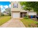Inviting home featuring a single-car garage, cozy front porch, and a well-manicured lawn at 905 Magnolia Gardens Walk, Mcdonough, GA 30253