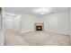 Spacious living room with a cozy fireplace, carpeted floors, and ample natural light at 905 Magnolia Gardens Walk, Mcdonough, GA 30253