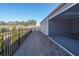 Backyard featuring a screened patio, a fence, and well-maintained landscaping at 171 Echols Bnd, Hiram, GA 30141