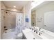Modern bathroom with marble tiled shower, tub, toilet, and vanity with a chrome faucet at 171 Echols Bnd, Hiram, GA 30141