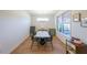 Bright dining room featuring modern light fixture, a large window, and sleek furniture at 171 Echols Bnd, Hiram, GA 30141