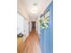 Bright entryway featuring wood floors and a charming door with a floral wreath at 171 Echols Bnd, Hiram, GA 30141