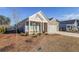 Inviting home boasting manicured front lawn, brick accents, and a covered entryway at 171 Echols Bnd, Hiram, GA 30141