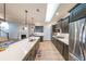 Modern kitchen boasting stainless steel appliances, dark cabinets, and a bright open layout at 171 Echols Bnd, Hiram, GA 30141
