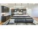 Modern kitchen featuring dark cabinets, stainless steel appliances, a center island, and pendant lighting above the island at 171 Echols Bnd, Hiram, GA 30141