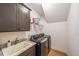 A convenient laundry room features modern machines, a utility sink, and practical storage solutions at 171 Echols Bnd, Hiram, GA 30141