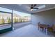 Covered patio with ceiling fan, offering an ideal space for outdoor relaxation and dining at 171 Echols Bnd, Hiram, GA 30141